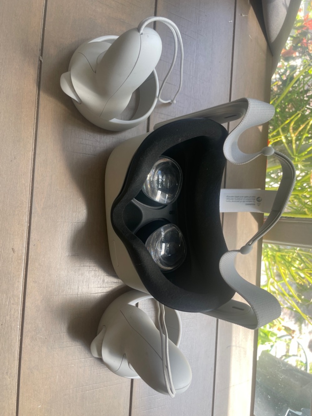 Oculus white standalone VR headset with white controllers and black face gasket